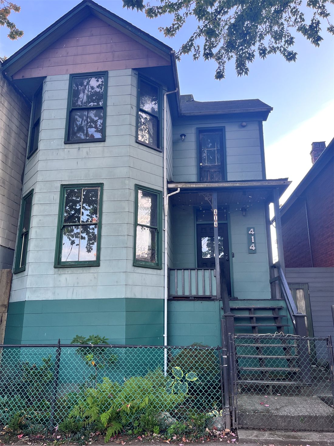 414 East Cordova, a house with a front door, porch, steps and a small front yard